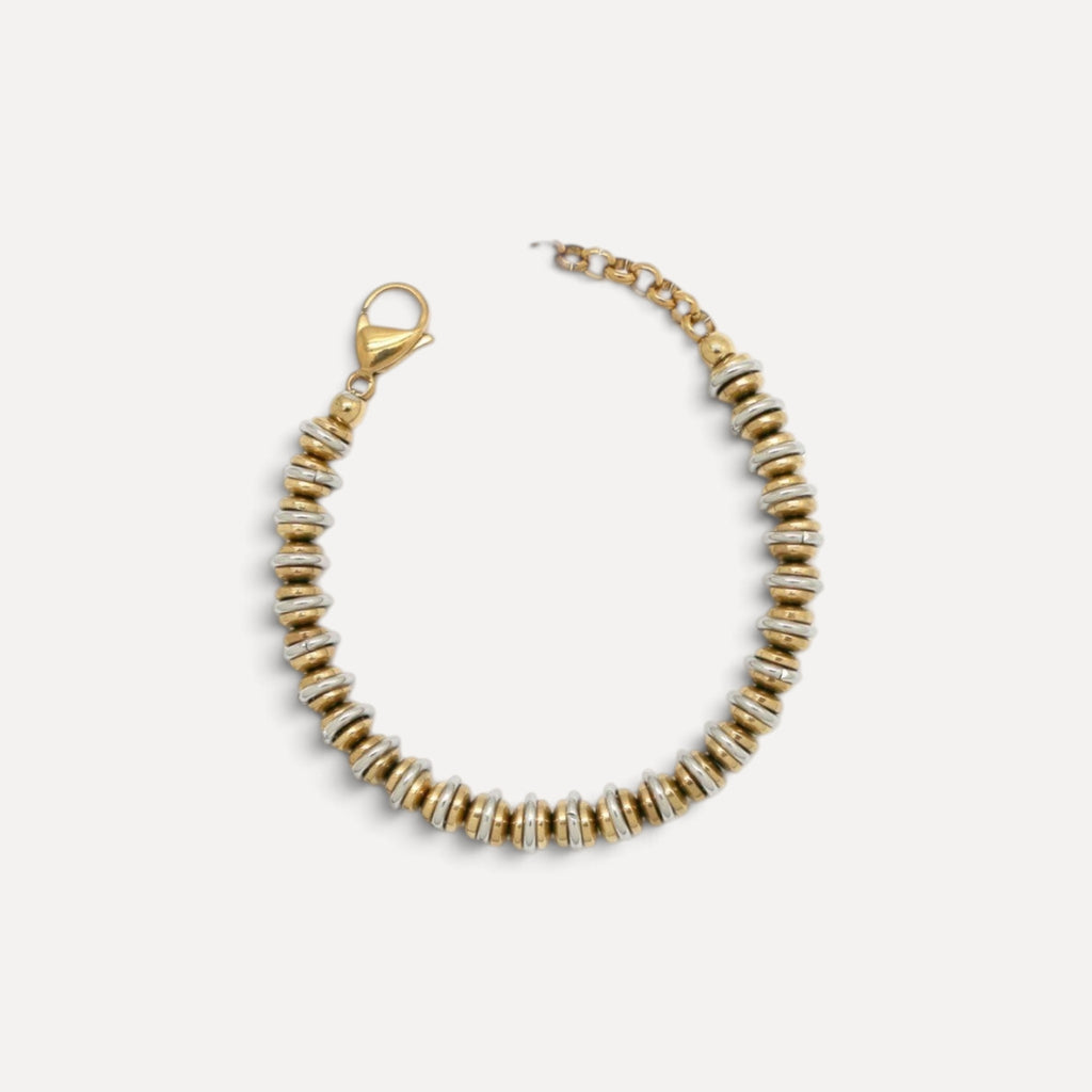 Pulseira Lifeaskika em aço inoxidável com discos bicolores dourados e prateados e fecho ajustável.
