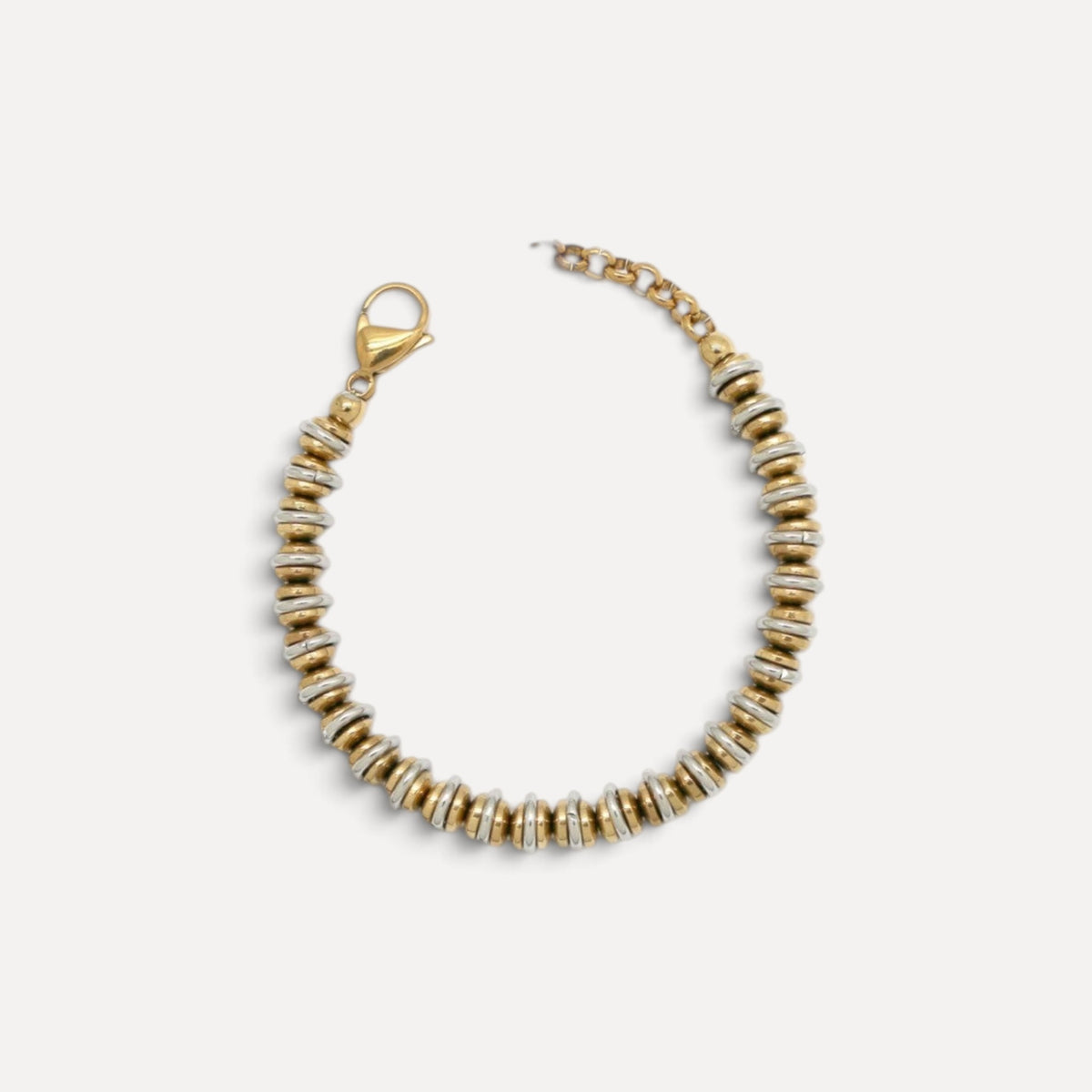 Pulseira Lifeaskika em aço inoxidável com discos bicolores dourados e prateados e fecho ajustável.