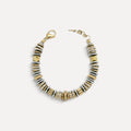 Pulseira Lifeaskika em aço inoxidável com discos intercalados em tons dourado e prateado e fecho tipo lagosta.